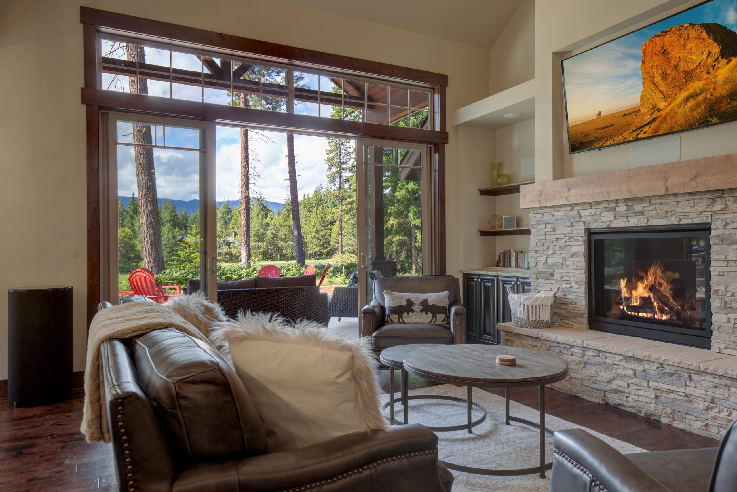 An absolute beautiful luxury living room with huge vaulted ceiling, fire place, harwood floor, amazing furniture, and lots of windows and doors. An absolute beautiful luxury living room with huge vaulted ceiling, fire place, harwood floor, amazing furniture, and lots of windows and doors.
